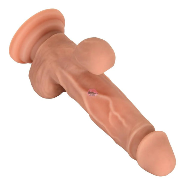 The Secret Affaire's Mr. Lover Sucking Thrusting Dildo Vibrator, with a lifelike flesh-toned silicone design, suction base, realistic veins, and texture, is displayed against a white background.
